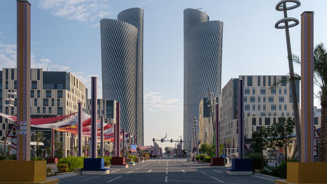 A street with two skyscrapers at the end 